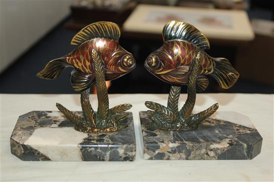 A pair of French Art Deco painted bronze bookends, modelled as fish amongst reeds, 5.5in.